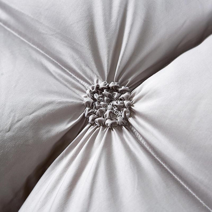 Stack of luxurious PlumeLux 100% goose down duvets, offering all-season comfort, soft bedding & warmth.