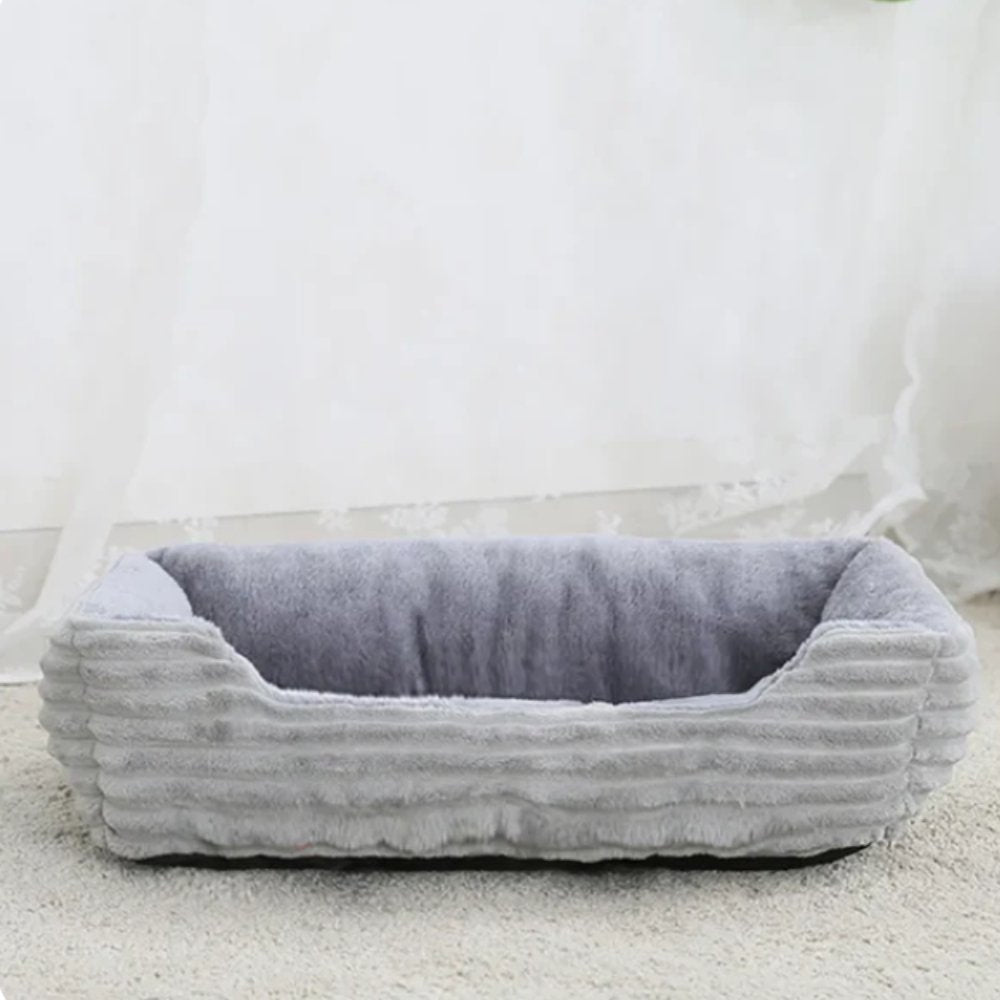 Washable plush pet bed, cozy comfort for cats & small dogs. Soft, non-slip luxury design.