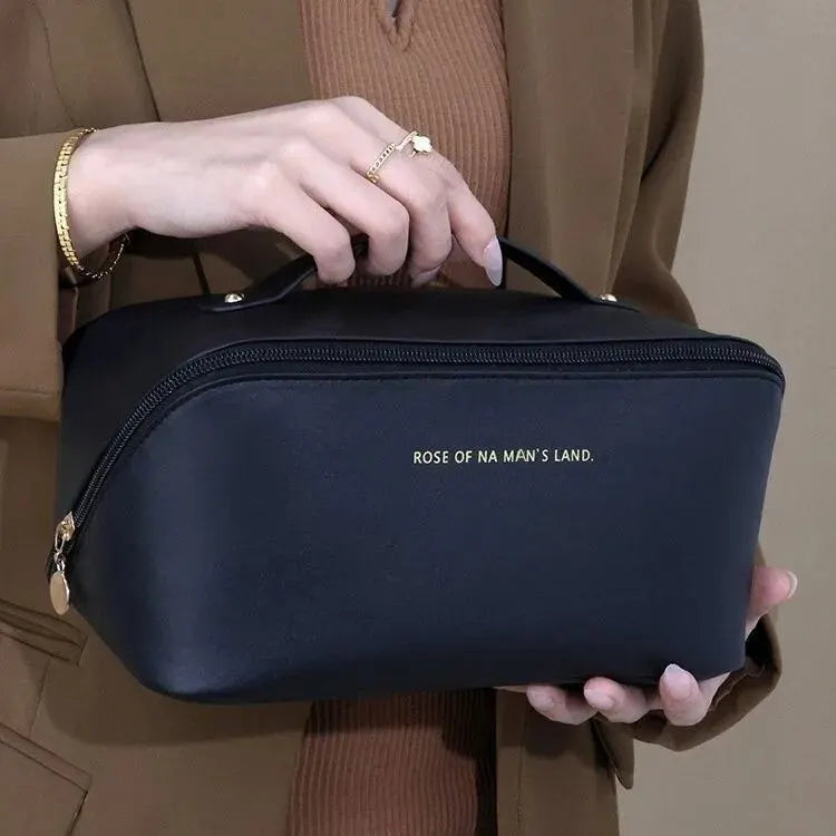 Women's chic gold PU leather makeup organizer bag, combining style and functionality for travel.