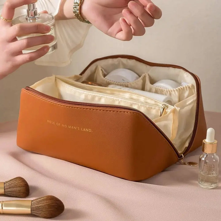 Luxury reddish-brown PU leather travel makeup organizer for women, featuring robust zipper and handle.