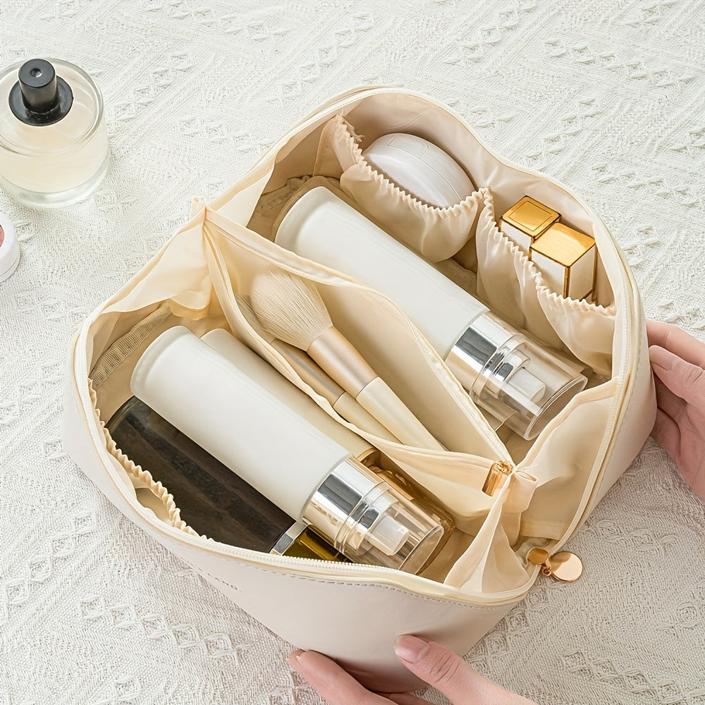Elegant pink PU leather makeup organizer bag, perfect for travel, features durable zipper and spacious interior.