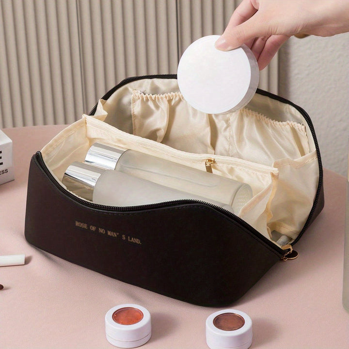 Compact PU leather toiletry bag for women's travel, designed to neatly store makeup and beauty essentials.