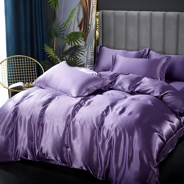 Bedroom featuring a sumptuously soft satin bedding set, inviting comfort and style.