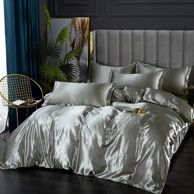 Soft satin bedding set with a fitted sheet and pillowcases, enhancing luxury bedroom aesthetics.