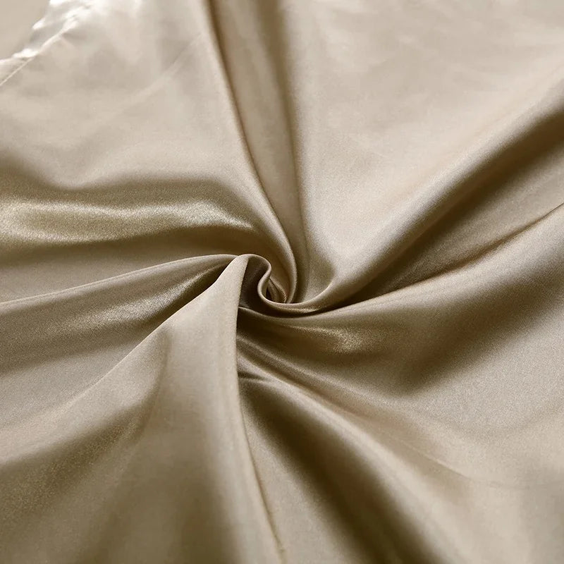 Luxury satin bedding set in a rich jewel tone, adding opulence to bedroom decor.