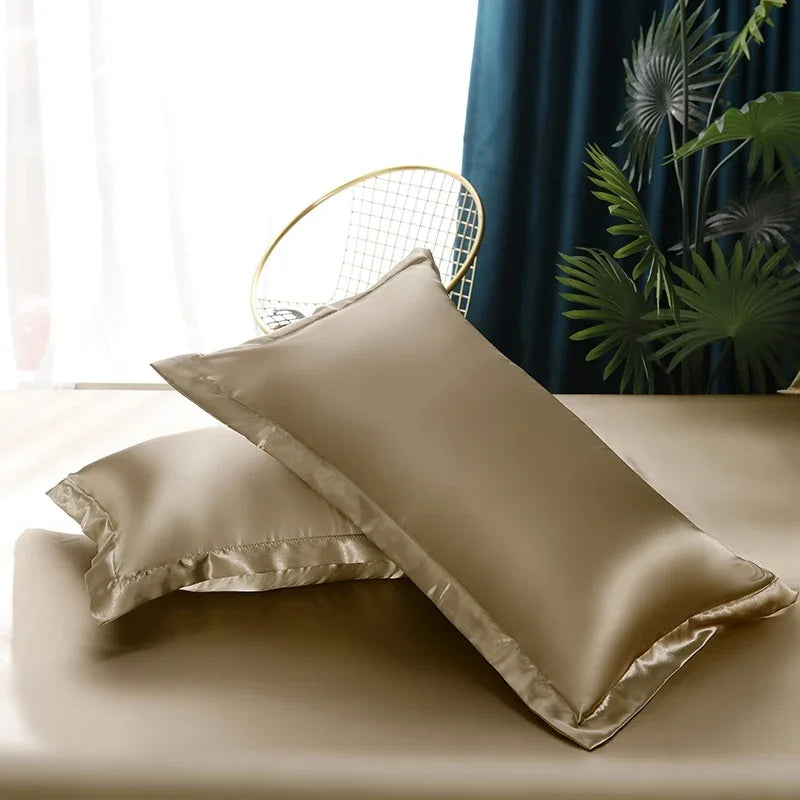 Soft, shimmering satin duvet cover and pillowcases, creating a sophisticated sleep environment.