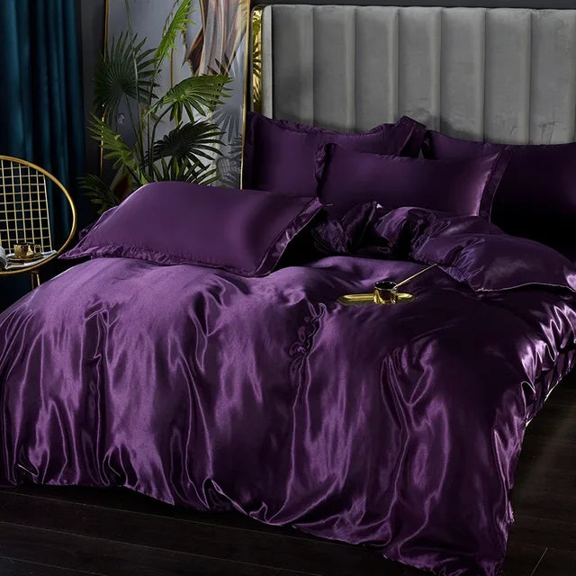 Full view of a king-size luxury satin duvet cover and fitted sheet on a modern bed.
