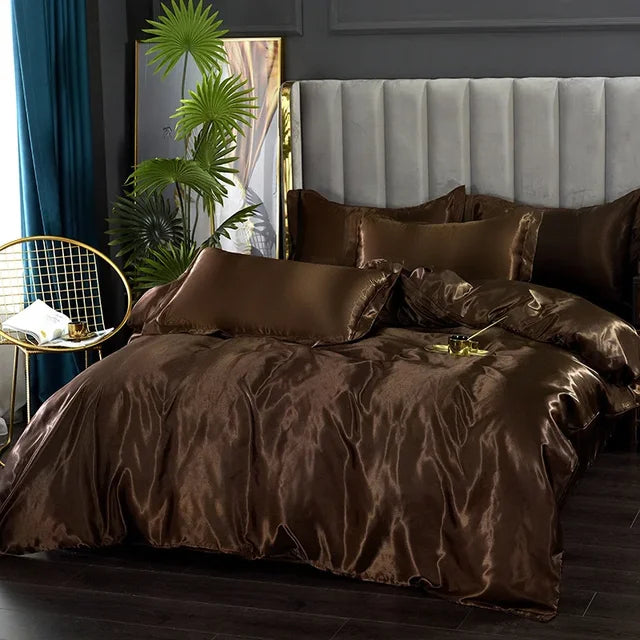 Beautifully draped satin bedding set, including duvet cover, sheet, and two pillowcases.
