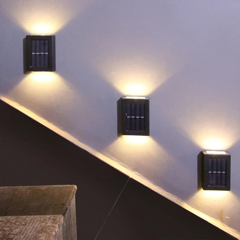 Close-up of a weather-resistant luxury solar LED outdoor wall light with integrated panel.
