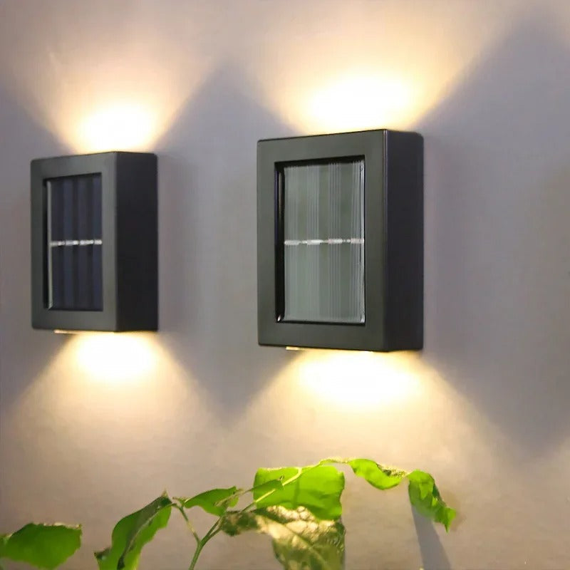 Array of solar-powered LED wall lights enhancing the ambiance and security of a home's facade.
