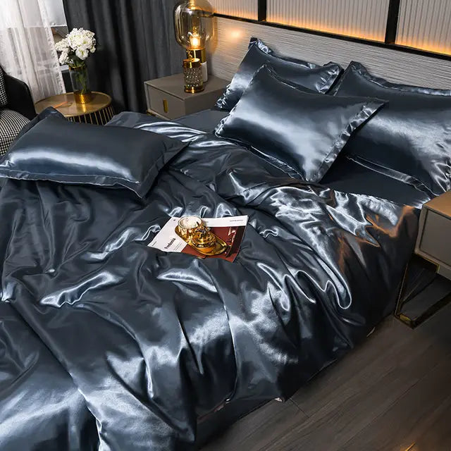 Soft, silk-feel satin duvet cover set in a solid hue, perfect for a luxurious bedroom.