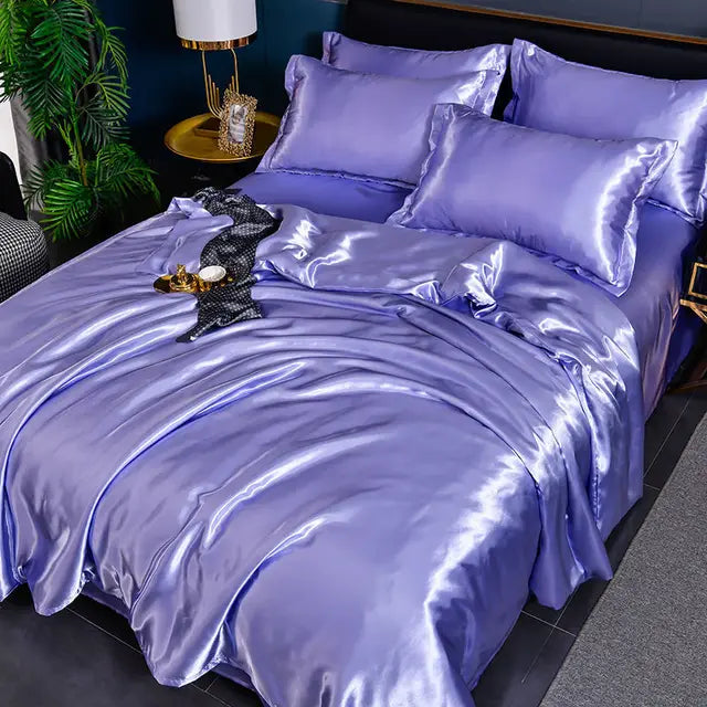 Bedroom featuring a sophisticated solid color satin duvet cover set and matching pillows.