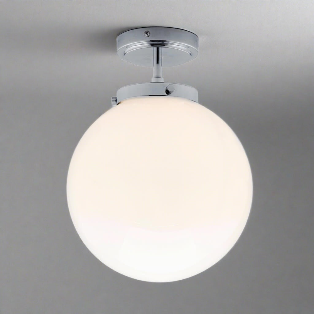 Luxury spherical LED bathroom ceiling light, modern design, damp rated for elegant homes.