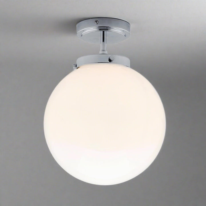 Luxury spherical LED bathroom ceiling light, modern design, damp rated for elegant homes.