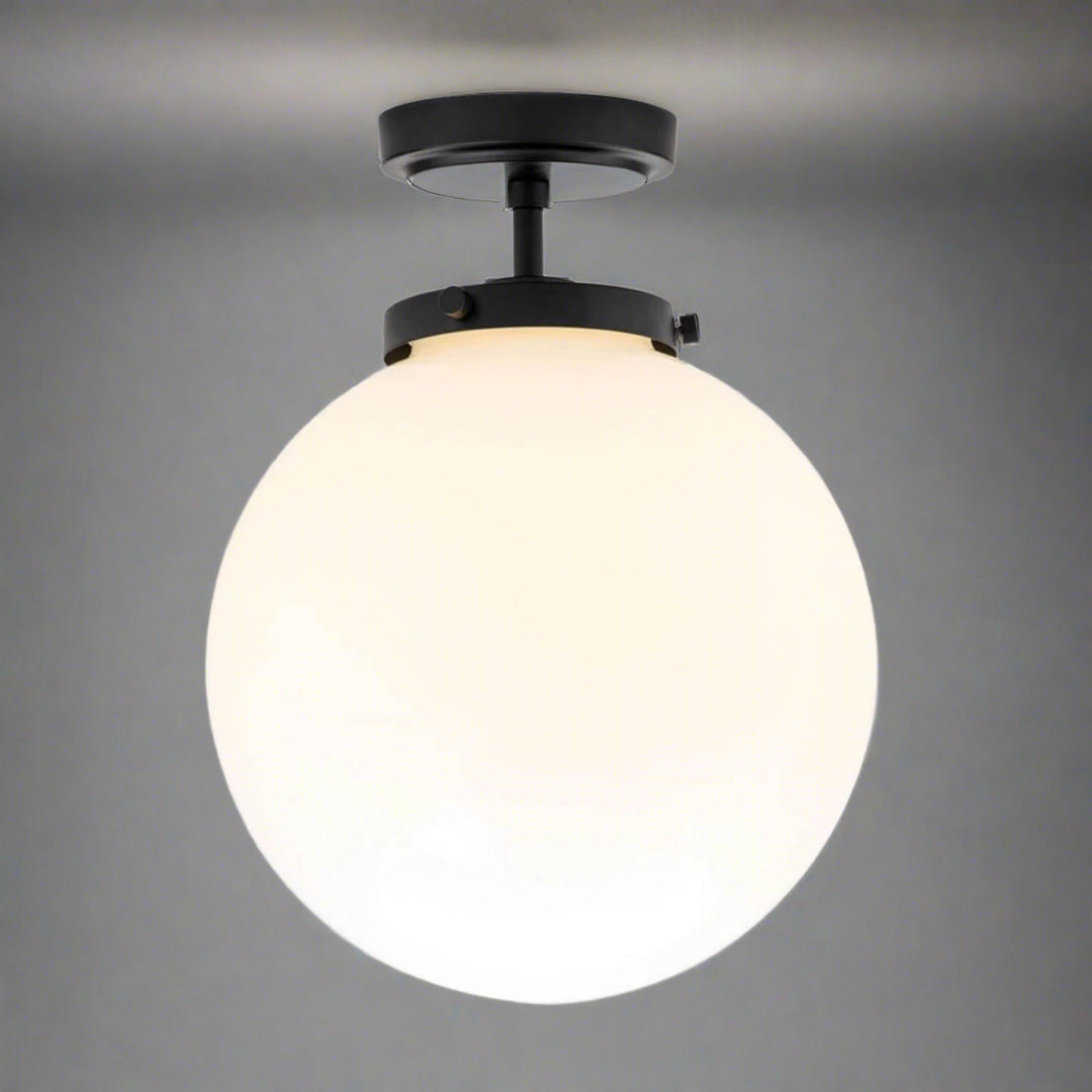 Stylish spherical bathroom ceiling fixture, LED lighting, damp rated for a sophisticated look.