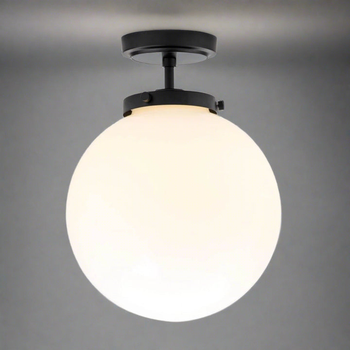Stylish spherical bathroom ceiling fixture, LED lighting, damp rated for a sophisticated look.