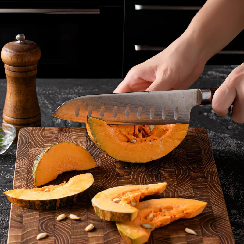 Natural teak wood cutting board, a luxurious and essential home goods item for any chef's kitchen food prep.