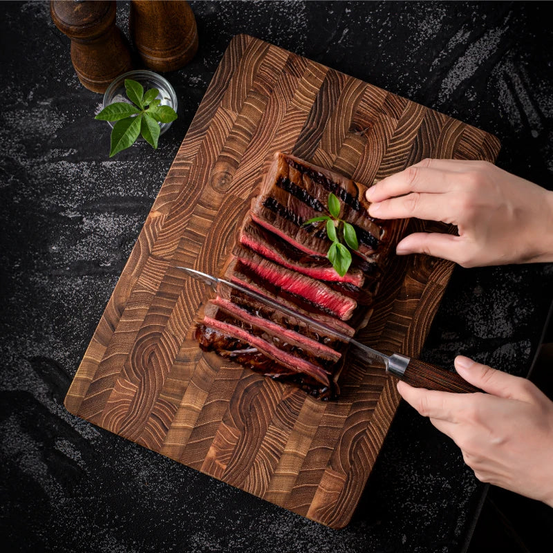 Premium thick teak wood cutting board for kitchen. High-quality, durable wood essential for luxury food prep.