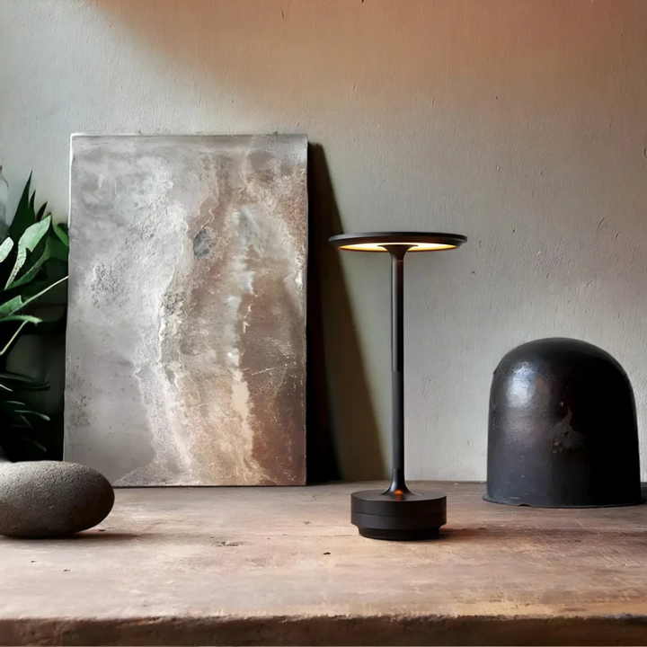Modern luxury table lamp, wireless & rechargeable, creating ambient light for any room. Home decor essential.