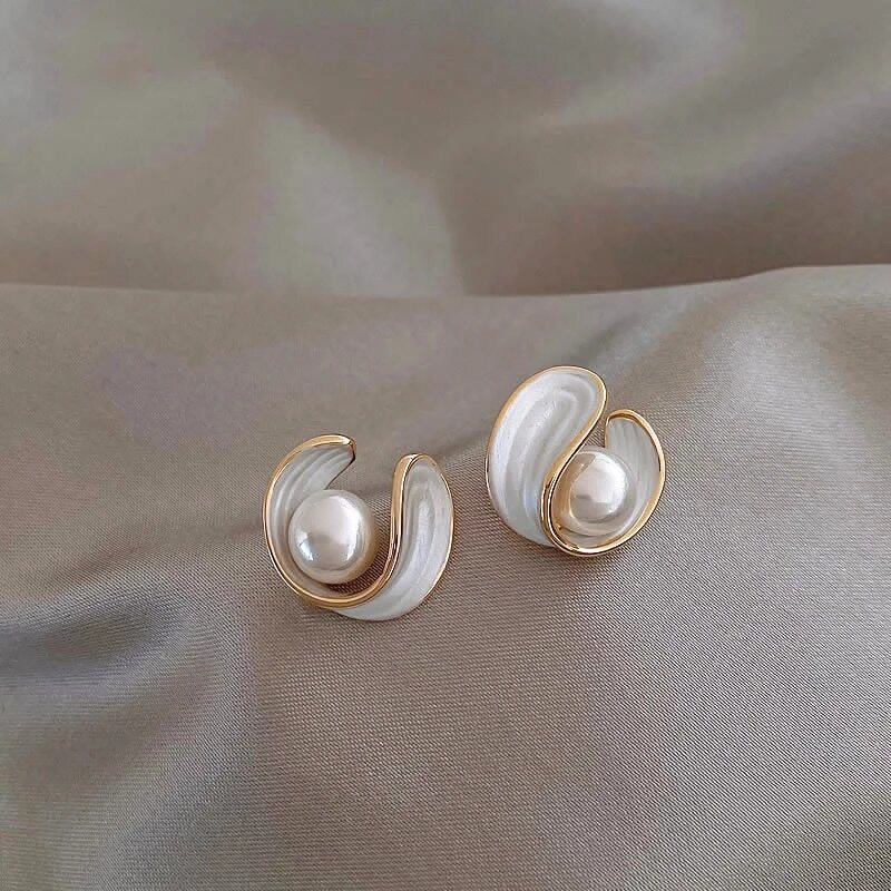 Luxury women's gold tone dangle earrings with white opal & luminous pearl drops, perfect for elegant occasions.
