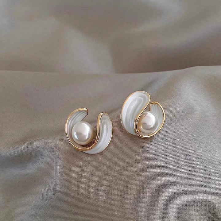 Luxury women's gold tone dangle earrings with white opal & luminous pearl drops, perfect for elegant occasions.