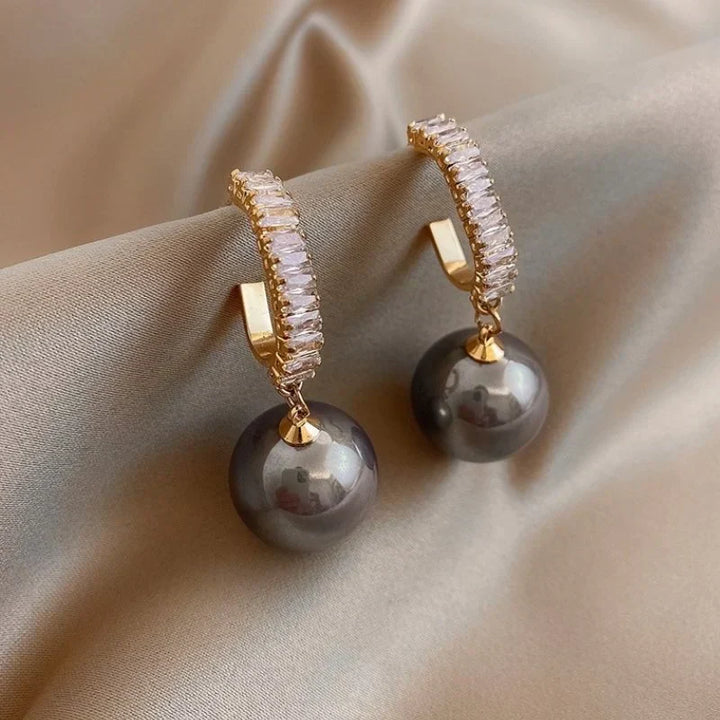 Luxury women's pearl & zirconia drop earrings. Elegant fashion jewelry, perfect for weddings or special occasions.