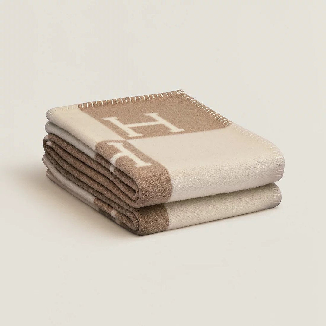 Hand-finished wool and cashmere plaid throw, showcasing its premium quality and classic plaid pattern.