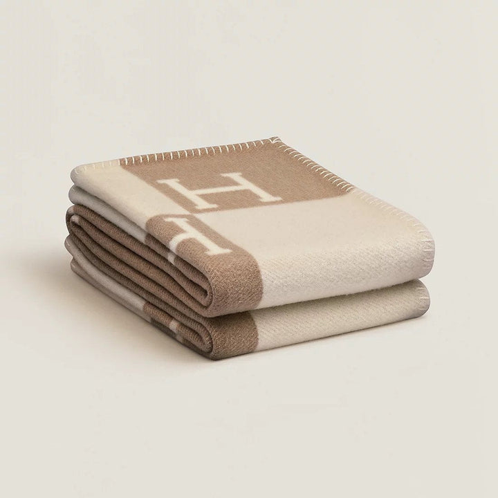 Hand-finished wool and cashmere plaid throw, showcasing its premium quality and classic plaid pattern.