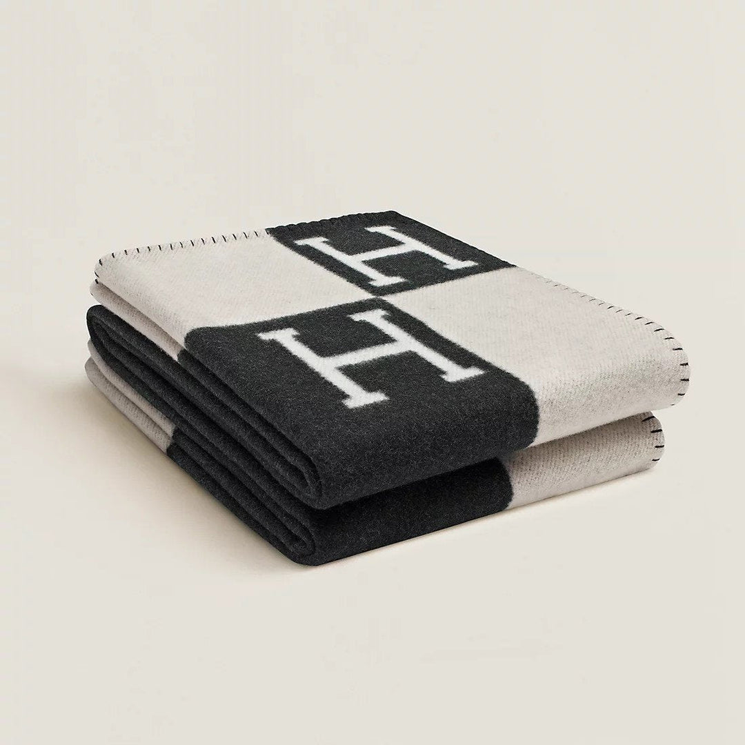 Elegant gray and white plaid wool cashmere throw, perfect as a decorative throw blanket for sofa or bed.