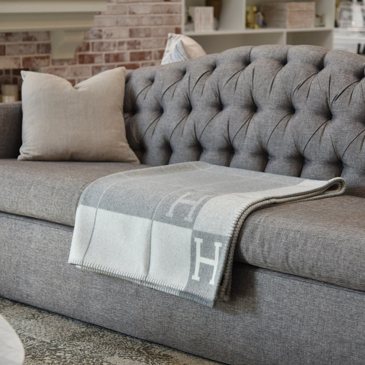 Stylish women's luxury plaid throw, featuring wool and cashmere, adding a touch of elegance to any room.