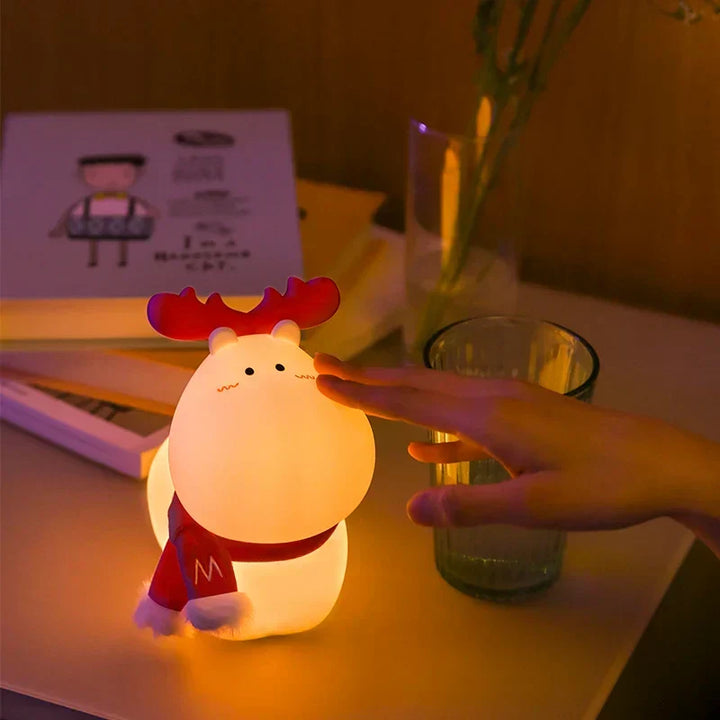 Cute LED reindeer night lamp, ideal Christmas gift for kids' rooms & nurseries. Soft silicone glow for bedtime.