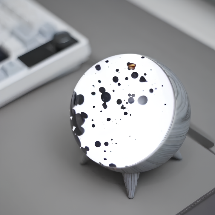 Lifestyle image of MagnePulse ferrofluid display on a desk, enhancing the workspace with unique, interactive decor