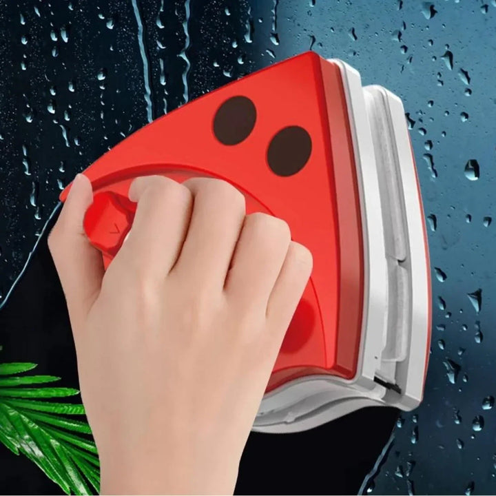 Dual-sided magnetic window cleaner in action, ensuring streak-free glass with ease.