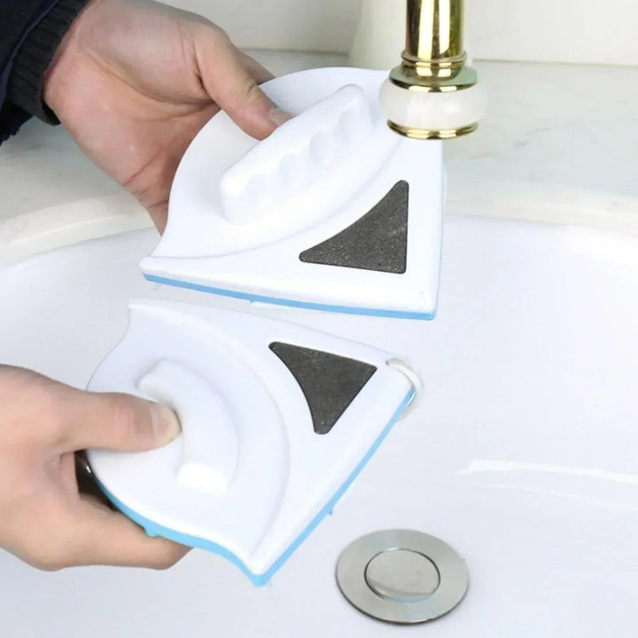 Close-up of a magnetic window cleaner on glass, demonstrating streak-free results.