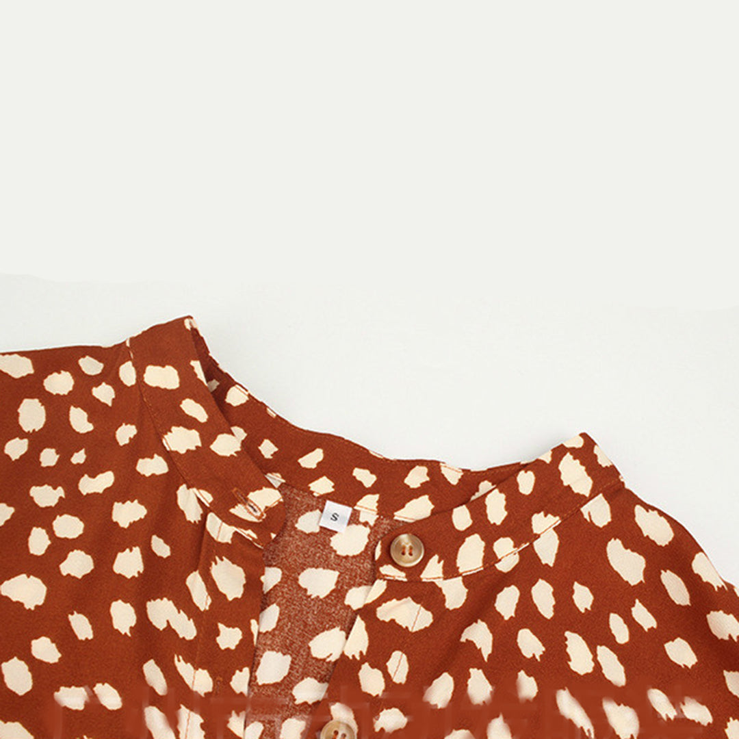 Close-up of lightweight polyester printed V-neck midi dress for women, casual style