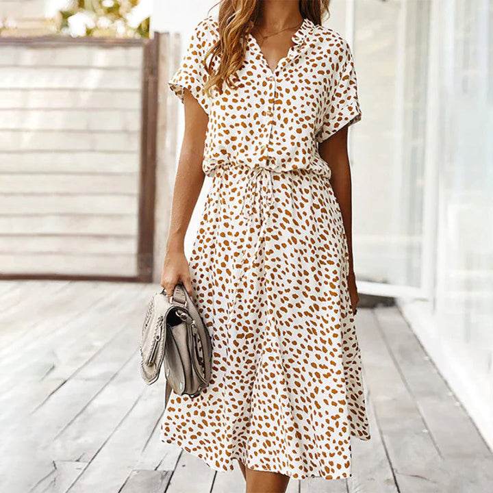 Back view of women's Marielle printed V-neck A-line midi dress, flowing fabric