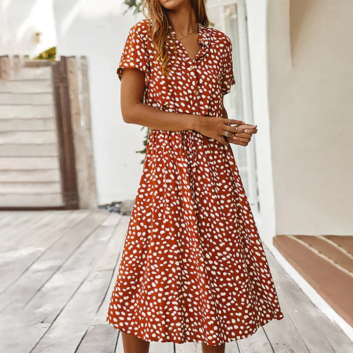 Side profile of the casual women's printed V-neck midi dress, perfect for warm weather