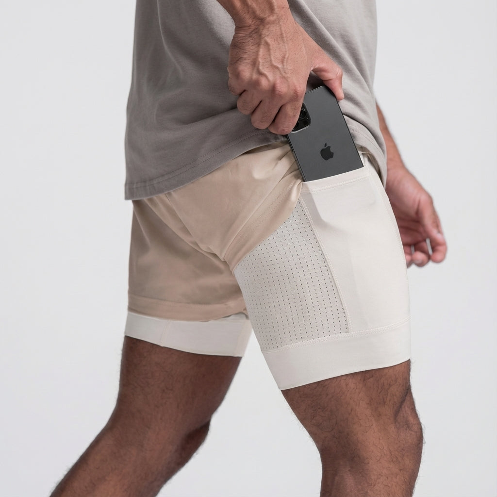 Black men's 2-in-1 workout shorts featuring a functional phone pocket and moisture-wicking fabric.