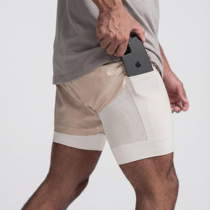 Black men's 2-in-1 workout shorts featuring a functional phone pocket and moisture-wicking fabric.