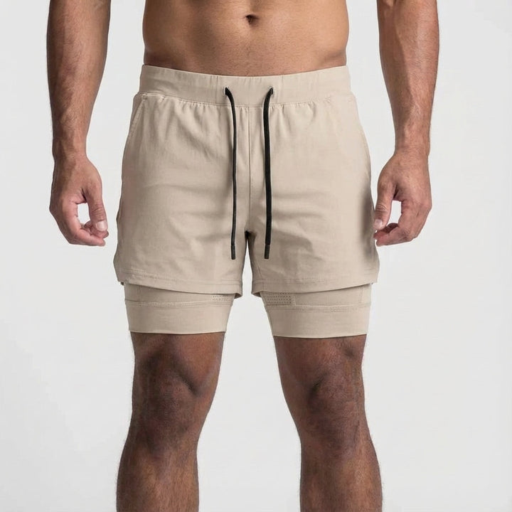 Men's athletic 2-in-1 gym shorts in black, designed for performance training.