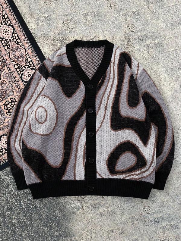 Close-up of a men's unique abstract pattern cardigan, showcasing its vibrant design and button-front closure.