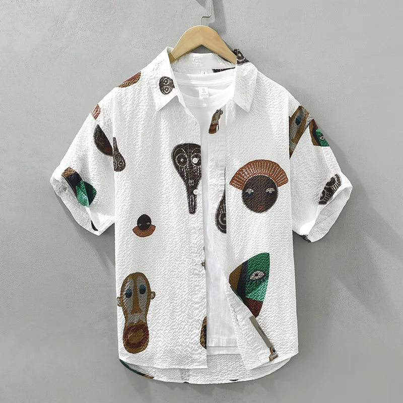 Men's abstract tribal art shirt with bold cubist print. Short sleeve casual top for artistic fashion.