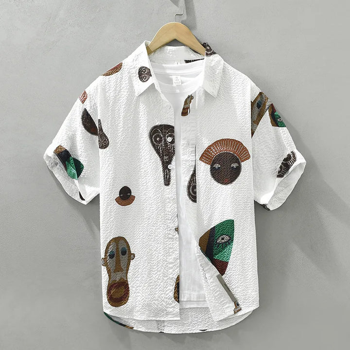 Men's abstract tribal art shirt with bold cubist print. Short sleeve casual top for artistic fashion.