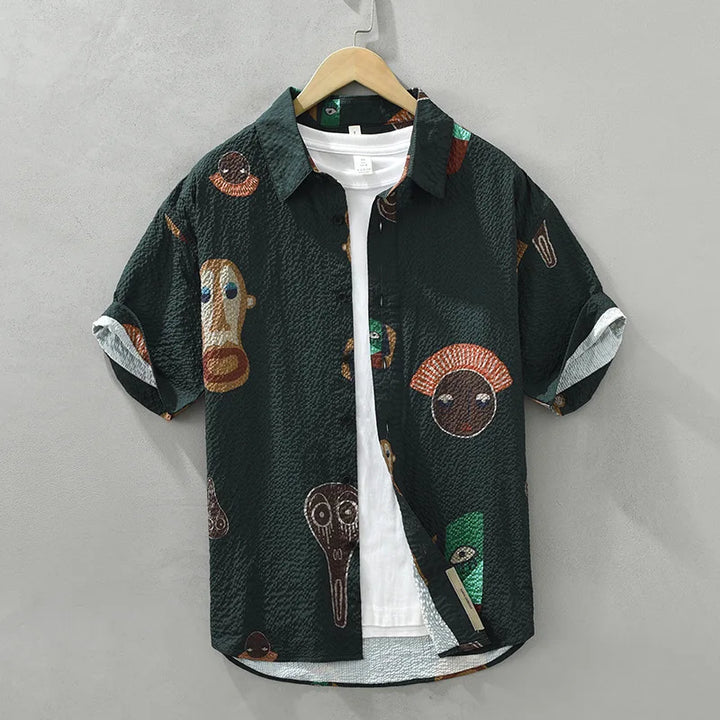 Unique men's cubist tribal art shirt. Short-sleeve, casual statement piece with abstract print.