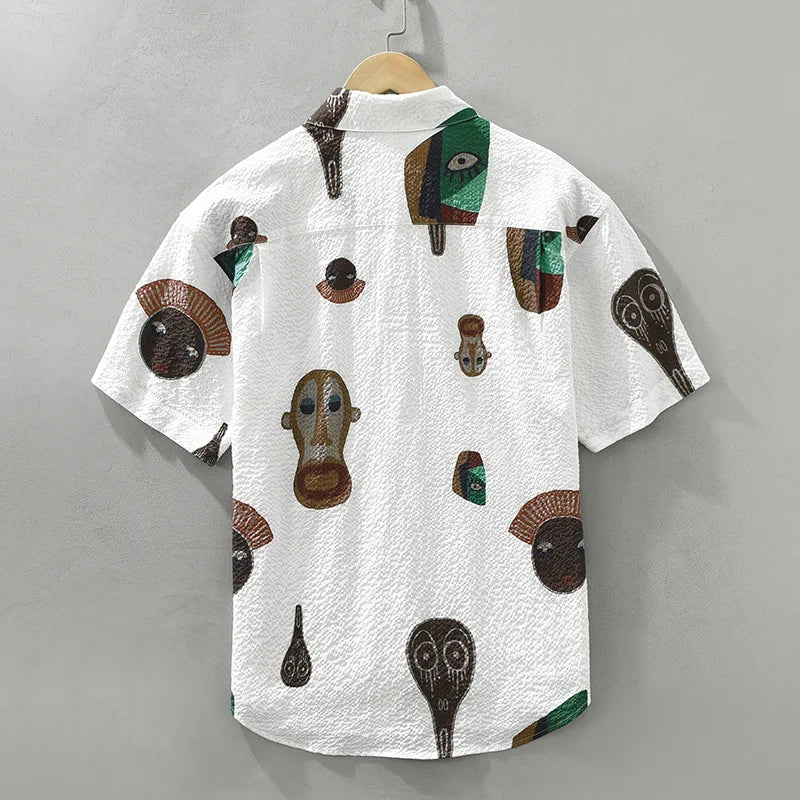 Detailed men's abstract tribal print shirt. Cubist design, short sleeve, perfect for artistic casual wear.