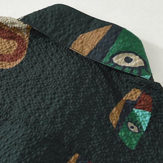 Striking men's abstract art shirt featuring a cubist tribal pattern. Short sleeve, unique design for men.