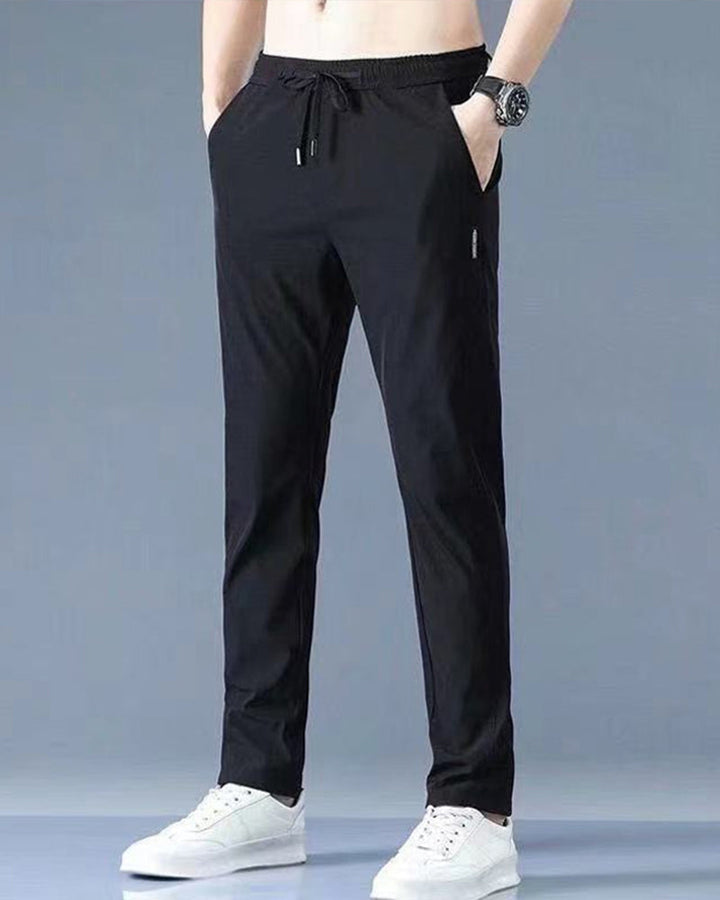 Athletic men's activewear trousers, fast-drying & flexible for hiking or casual wear.