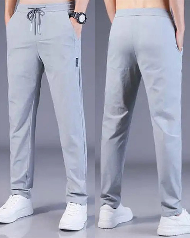 Stylish men's casual trousers, AeroFlex quick-dry & stretch for modern athletic look.