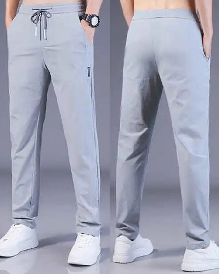 Stylish men's casual trousers, AeroFlex quick-dry & stretch for modern athletic look.