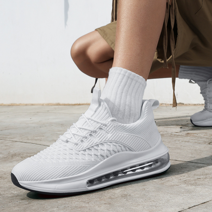 Detailed view of Men's Airvault Max sneaker upper, breathable design for active running & training.